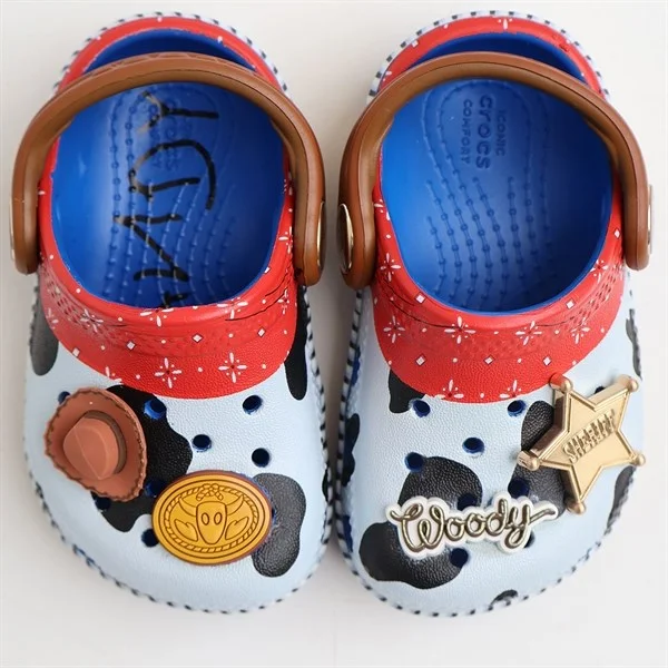 Women's Sandals with a Floral - Printed Upper in Pink for a Feminine Spring LookCrocs Toy Story Woody Classic Clog Blue Jean Women's Sandals with a Floral - Printed Upper in Pink for a Feminine Spring LookCrocs Toy Story Woody Classic Clog Blue Jean